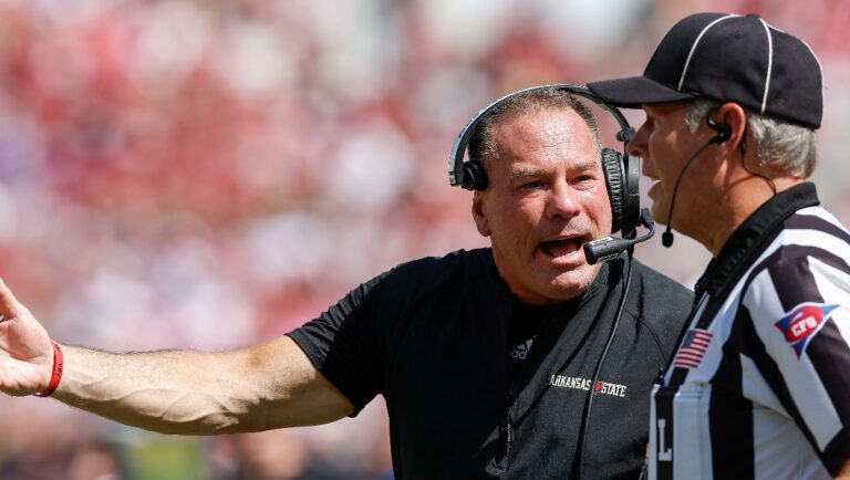 Arkansas State head coach Butch Jones talks to an official during the first half of an NCAA college football game against Oklahoma on Saturday, Sept. 2, 2023, in Norman, Okla. (AP Photo/Alonzo Adams)