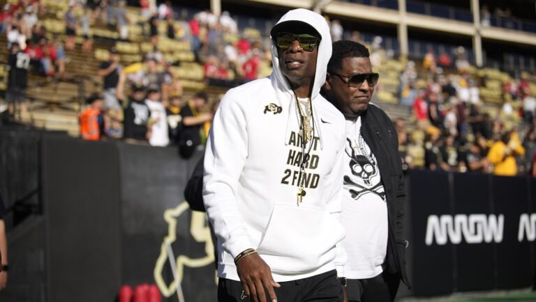 Cincinnati Bearcats wide receiver Tyler Scott, center, celebrates with Jadon Thompson (20) and Charles McClelland (10) after scoring a touchdown during the first half of an NCAA college football game against East Carolina, Friday, Nov. 11, 2022, in Cincinnati.