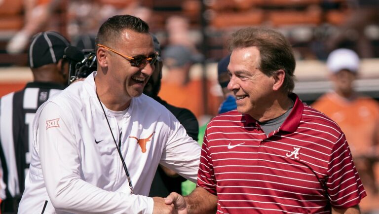 Texas head coach Steve Sarkisian, left, and Alabama head coach Nick Saban, right, meet on the field during team warmups before an NCAA college football game, Saturday, Sept. 10, 2022, in Austin, Texas. (AP Photo/Rodolfo Gonzalez)