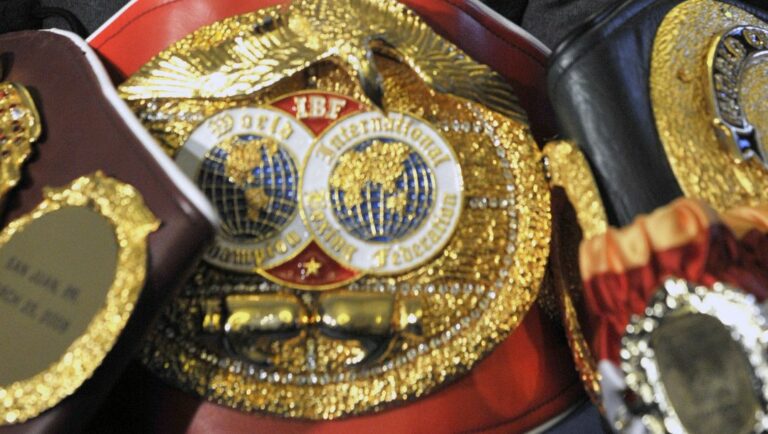 Ukrainian boxer Wladimir Klitschko, poses with his belts, during a press conference in London, Thursday, Oct. 21, 2010.