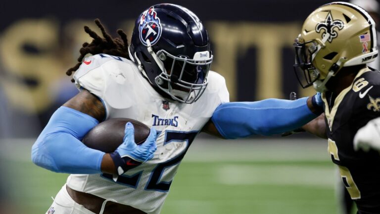 Tennessee Titans running back Derrick Henry, left, stiff arms New Orleans Saints safety Marcus Maye, right, in the first half of an NFL football game in New Orleans, Sunday, Sept. 10, 2023.