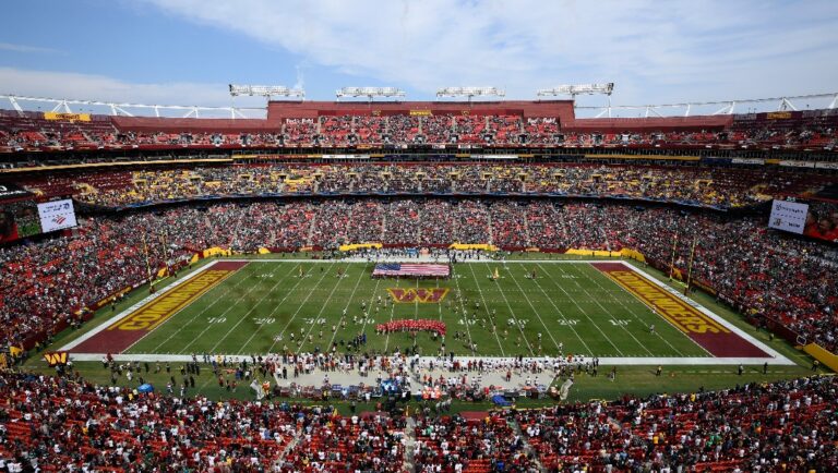 FILE - FedEx Field, home of the Washington Commanders NFL football team, is shown before the start of a football game between the Philadelphia Eagles and Washington Commanders, Sunday, Sept. 25, 2022, in Landover, Md. A group led by Josh Harris and Mitchell Rales that includes Magic Johnson has an agreement in principle to buy the NFL's Washington Commanders from longtime owner Dan Snyder for a North American professional sports team record $6 billion, according to a person with knowledge of the situation. The person spoke to The Associated Press on condition of anonymity Thursday, April 13, 2023, because the deal had not been announced. (AP Photo/Nick Wass, File)