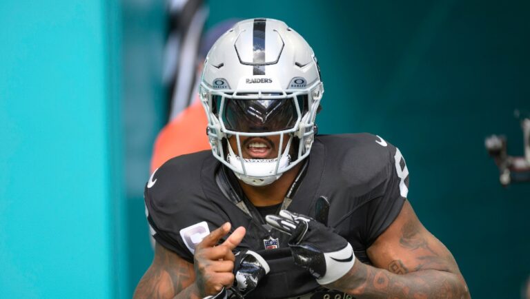 Las Vegas Raiders running back Josh Jacobs (8) runs onto the field before an NFL football game against the Miami Dolphins, Sunday, Nov. 19, 2023, in Miami Gardens, Fla. (AP Photo/Doug Murray)