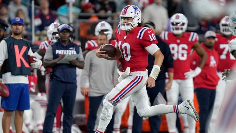 New England Patriots quarterback Mac Jones (10) runs with the ball during an NFL football game against the Miami Dolphins, Sunday, Sept. 17, 2023, in Foxborough, Mass.