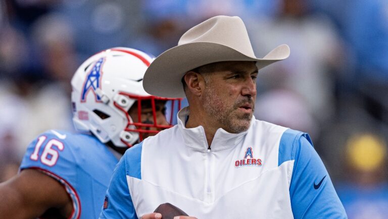 Tennessee Titans head coach Mike Vrabel throws to a player during warm ups before their NFL football game against the Houston Texans Sunday, Dec. 17, 2023, in Nashville, Tenn. (AP Photo/Wade Payne)