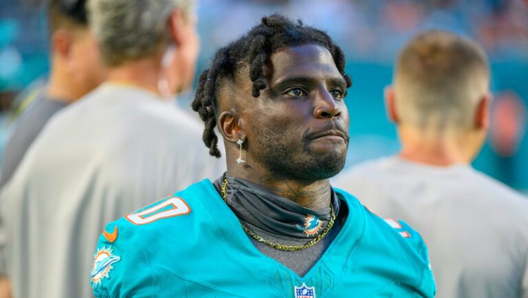 Miami Dolphins wide receiver Tyreek Hill (10) stands on the sidelines during an NFL pre-season football game against the Atlanta Falcons, Friday, Aug. 11, 2023, in Miami Gardens, Fla. (AP Photo/Doug Murray)