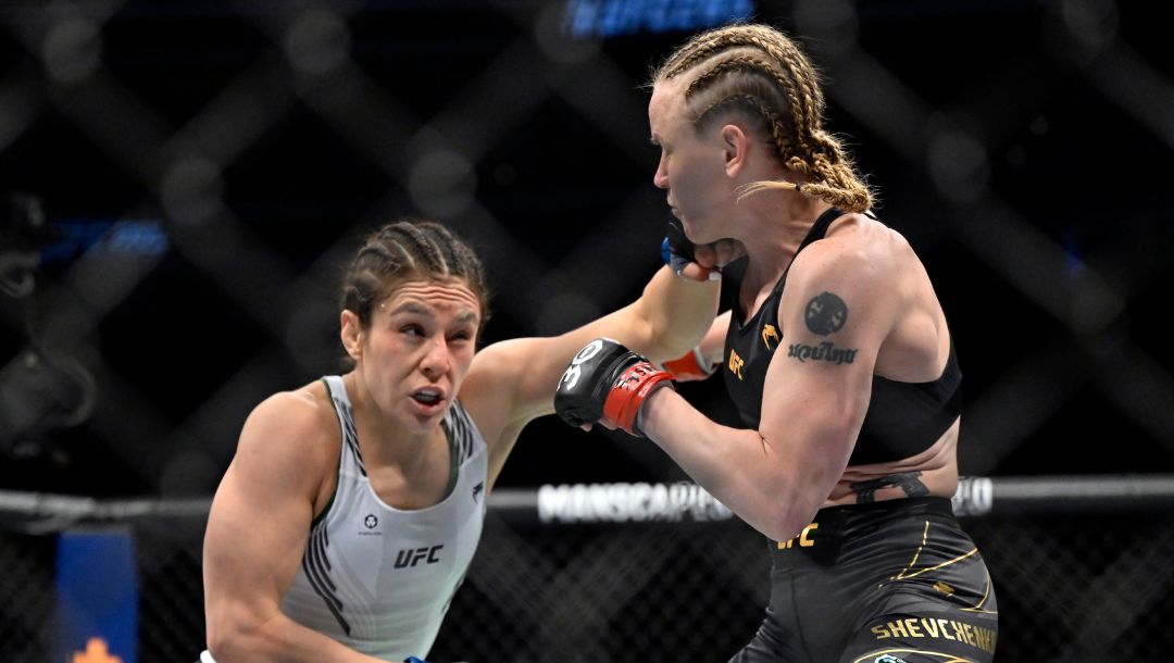 Alexa Grasso, left, jabs Valentina Shevchenko during a UFC 285 mixed martial arts flyweight title bout Saturday, March 4, 2023.