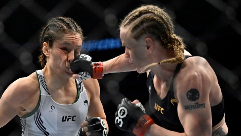 Alexa Grasso, left, is hit by Valentina Shevchenko during a UFC 285 mixed martial arts flyweight title bout Saturday.