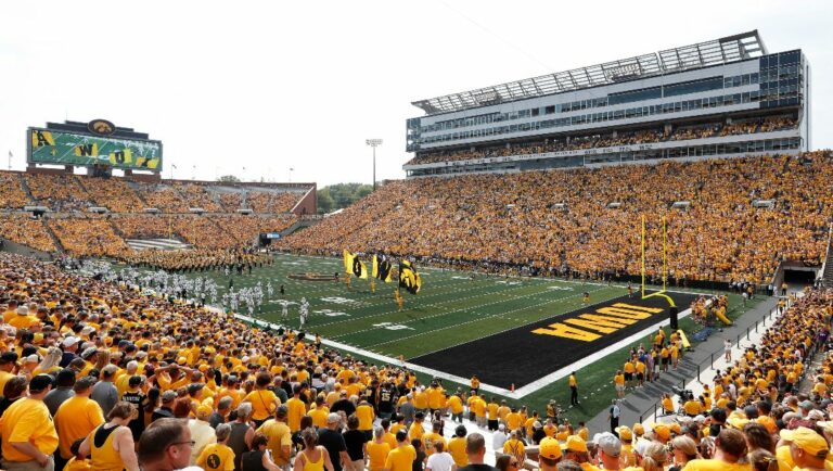 Fans cheer before an NCAA college football game between Iowa and North Texas at Kinnick Stadium in Iowa City, Iowa, Sept. 16, 2017. Iowa will attempt to set the all-time women's basketball attendance record when it hosts DePaul in an outdoor exhibition at 69,000-seat Kinnick Stadium on Oct. 15, the school announced Thursday, Aug. 10, 2023.