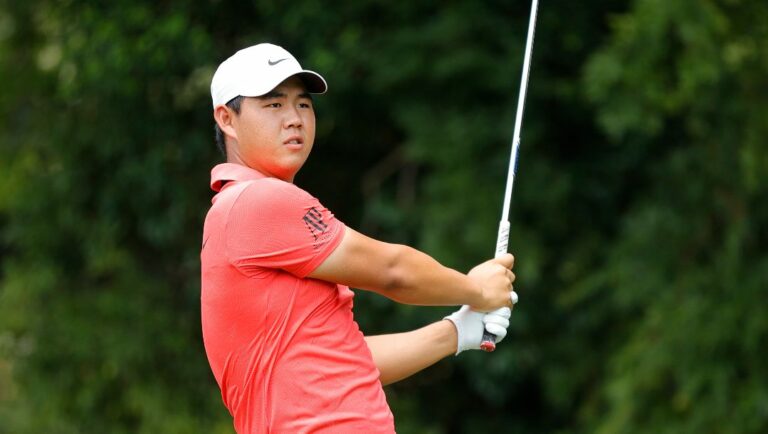 Tom Kim watches his tee shot on the second hole during the first round of the Tour Championship golf tournament at East Lake Golf Club, Thursday, Aug. 24, 2023, in Atlanta.
