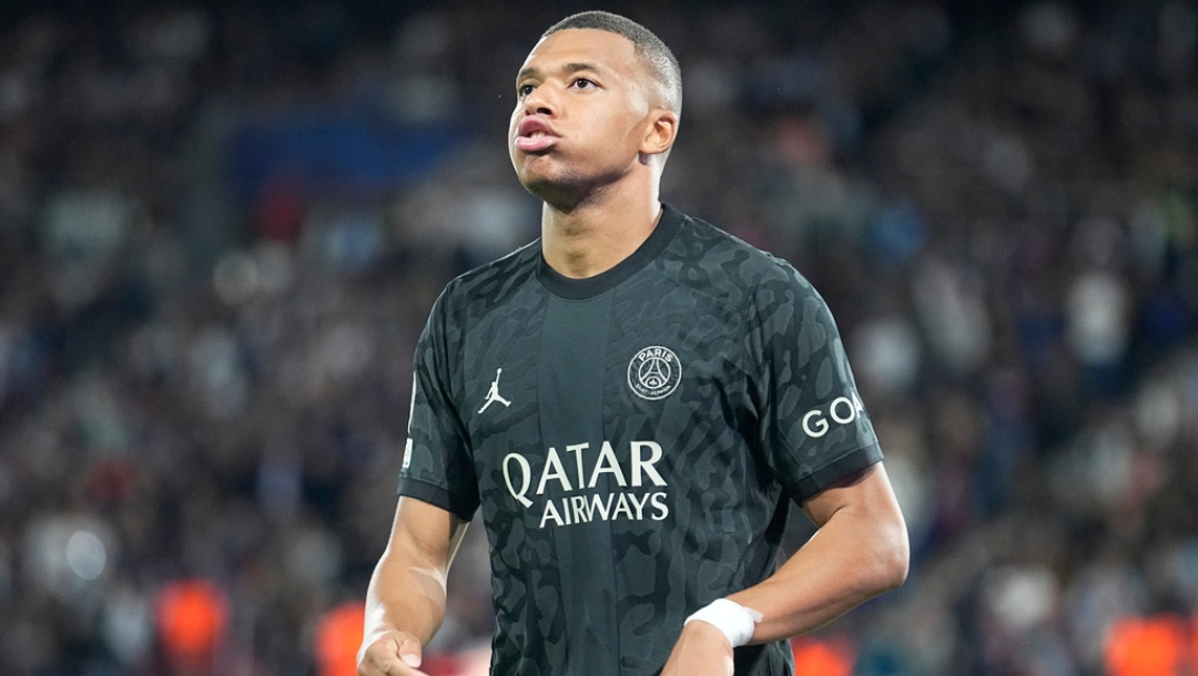 PSG's Kylian Mbappe reacts after missing a chance to score during the Champions League group F soccer match between Paris Saint-Germain and Borussia Dortmund, at the Parc des Princes stadium in Paris, France, Tuesday, Sept. 19, 2023.