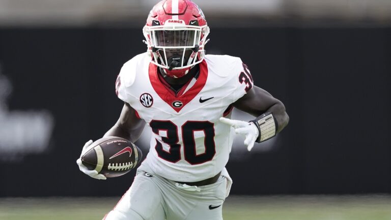 Georgia running back Daijun Edwards (30) runs the ball against Vanderbilt in the first half of an NCAA college football game Saturday, Oct. 14, 2023, in Nashville, Tenn.