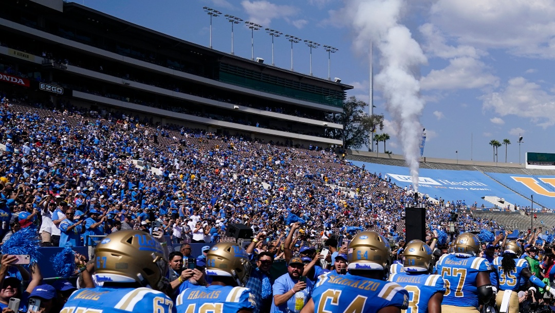 UCLA players take the field before an NCAA college football game against Utah in Pasadena, Calif., Saturday, Oct. 8, 2022. UCLA cleared a major hurdle toward joining the Big Ten Conference in 2024, getting approval for the move from the University of California Board of Regents on Wednesday, Dec. 14, 2022. (AP Photo/Ashley Landis, File)