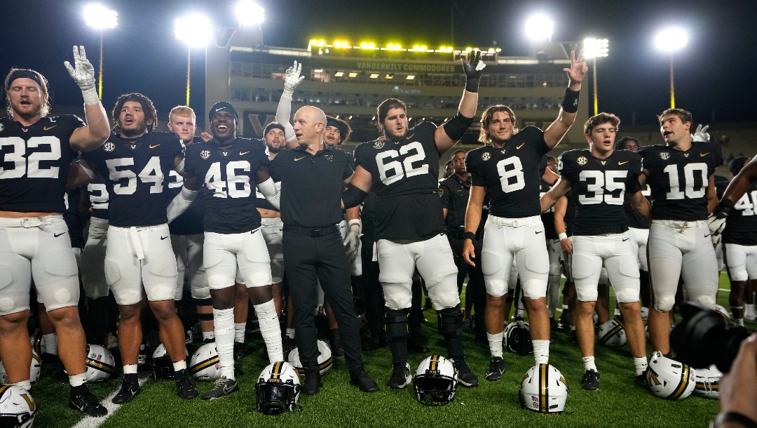 Vanderbilt head coach Clark Lea joins his players after beating Alabama A&M in an NCAA college football game Saturday, Sept. 2, 2023, in Nashville, Tenn. (AP Photo/Mark Humphrey)