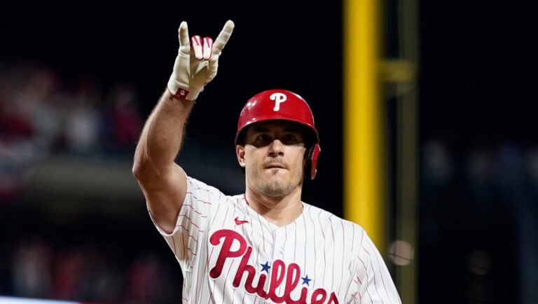 Philadelphia Phillies' J.T. Realmuto reatcs during Game 2 in an NL wild-card baseball playoff series, Wednesday, Oct. 4, 2023, in Philadelphia. (AP Photo/Matt Slocum)