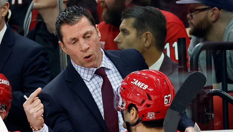 Carolina Hurricanes head coach Rod Brind'Amour talks with Max Pacioretty (67) during the second period of an NHL hockey game against the Nashville Predators in Raleigh, N.C., Thursday, Jan. 5, 2023. (AP Photo/Karl B DeBlaker)
