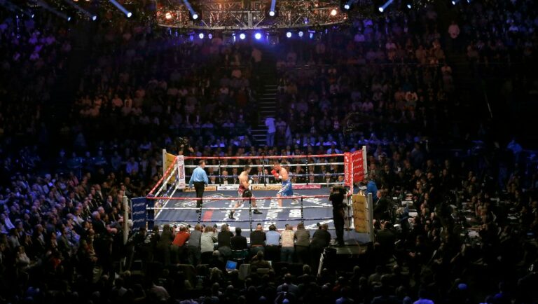 Carl Froch of Britain, left, fights against Mikkel Kessler of Denmark during their super-middleweight world title unification.