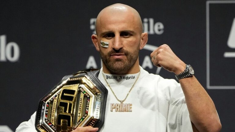 Alexander Volkanovski celebrates during a news conference for the UFC 290 Mixed Martial arts event Thursday, July 6, 2023.