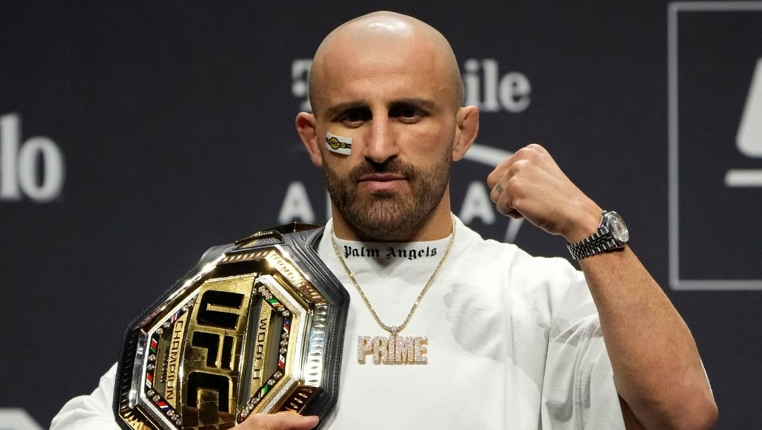 Alexander Volkanovski celebrates during a news conference for the UFC 290 Mixed Martial arts event Thursday, July 6, 2023.