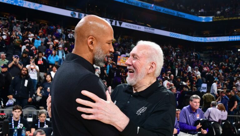 PHOENIX, AZ - APRIL 4: Head Coach Gregg Popovich of the San Antonio Spurs congratulates Head Coach Monty Williams.