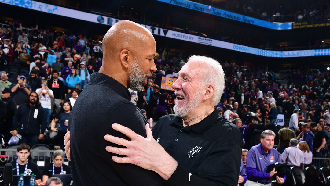 PHOENIX, AZ - APRIL 4: Head Coach Gregg Popovich of the San Antonio Spurs congratulates Head Coach Monty Williams.