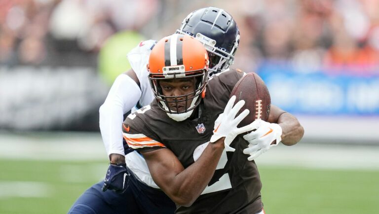 Cleveland Browns wide receiver Amari Cooper (2) makes a catch past Tennessee Titans cornerback Kristian Fulton during the first half of an NFL football game Sunday, Sept. 24, 2023, in Cleveland. The play was called incomplete as Cooper was ruled out of bounds.