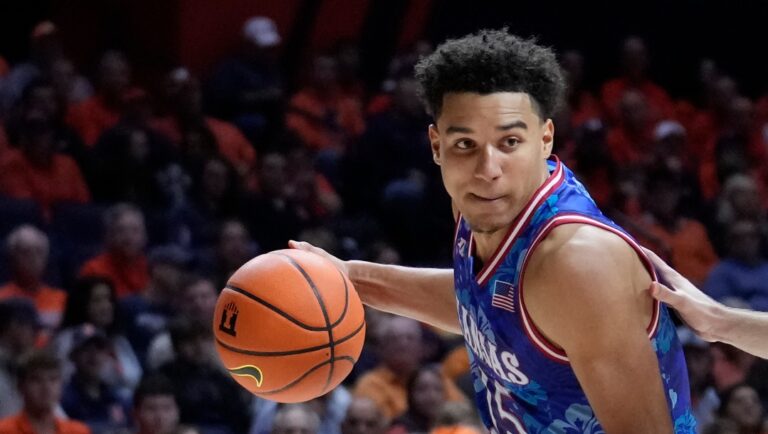 Kansas guard Kevin McCullar Jr. drives to the basket during an NCAA college basketball exhibition game against Illinois Sunday, Oct. 29, 2023, in Champaign, Ill. (AP Photo/Charles Rex Arbogast)