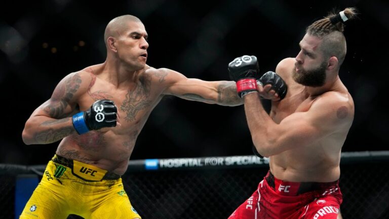 Brazil's Alex Pereira, left, punches Czech Republic's Jirí Procházka during the second round of a light heavyweight title bout.