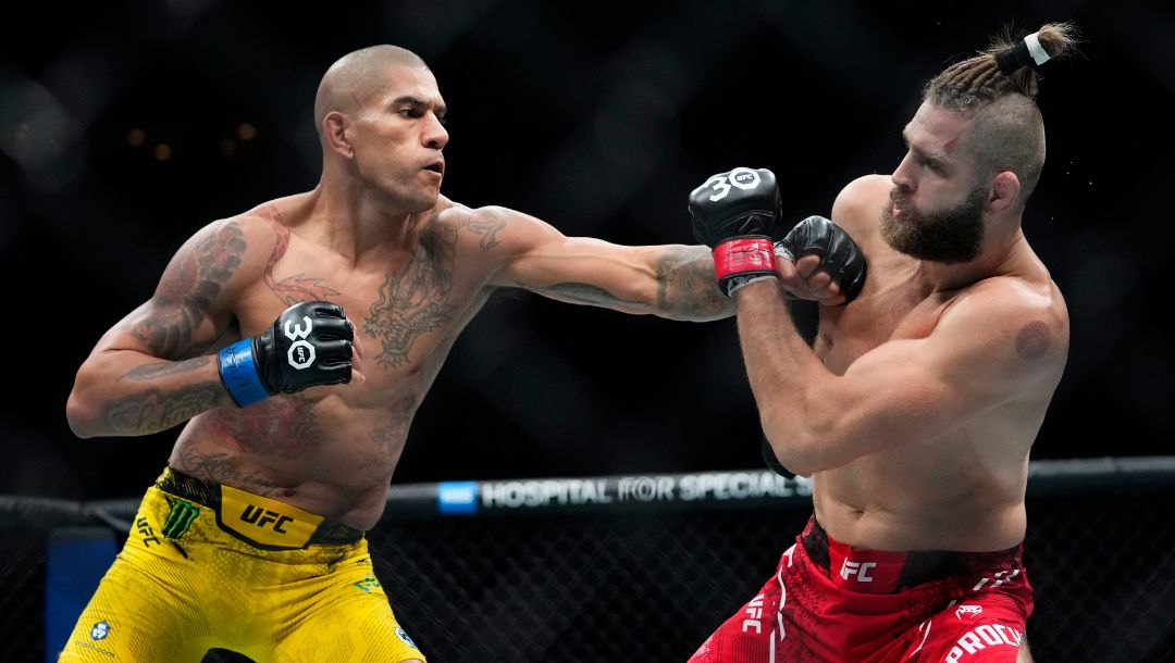 Brazil's Alex Pereira, left, punches Czech Republic's Jirí Procházka during the second round of a light heavyweight title bout.