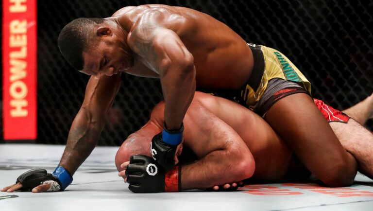 Brazil's Jailton Almeida, top, competes with Russia's Shamil Abdurakhimov in a heavyweight bout at the UFC 283 mixed martial arts.