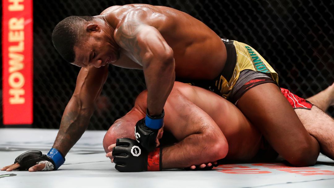 Brazil's Jailton Almeida, top, competes with Russia's Shamil Abdurakhimov in a heavyweight bout at the UFC 283 mixed martial arts.