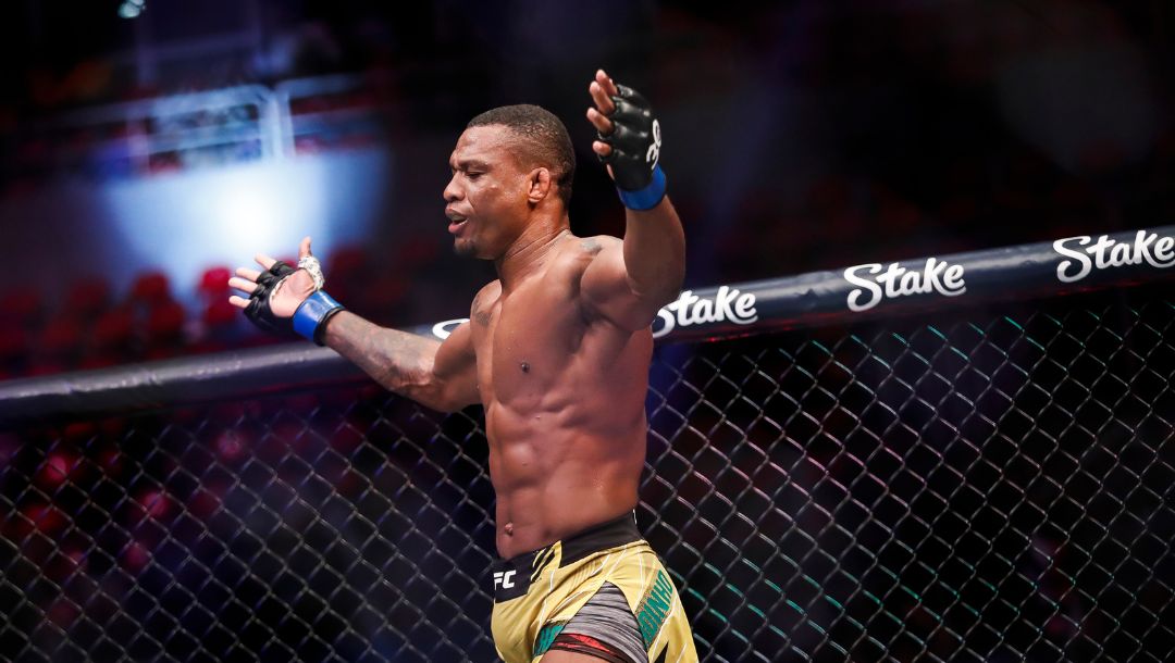 Brazil's Jailton Almeida celebrates his victory over Russia's Shamil Abdurakhimov in their a heavyweight bout at the UFC 283.