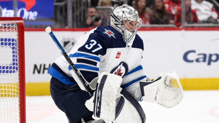 Winnipeg Jets goaltender Connor Hellebuyck (37) in action during the first period of an NHL hockey game against the Washington Capitals, Saturday, Feb. 1, 2025, in Washington. (AP Photo/Nick Wass)