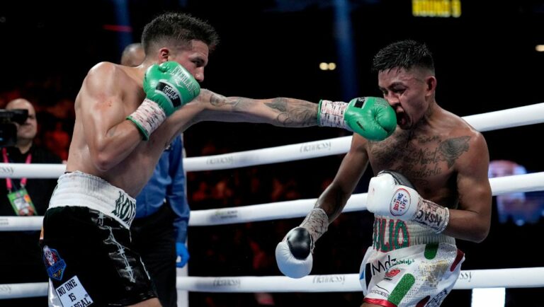 Jesse Rodriguez, left, fights Israel Gonzalez in a super flyweight title boxing match, Saturday, Sept. 17, 2022, in Las Vegas.