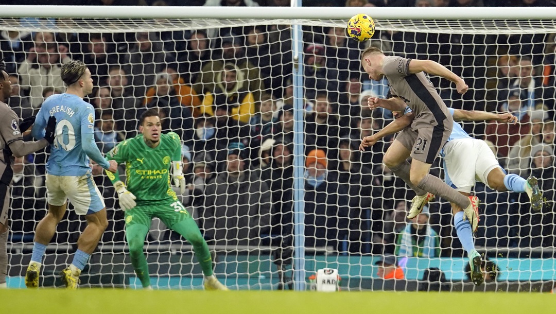 Tottenham's Dejan Kulusevski, foreground right, scores his side's third goal during the English Premier League soccer match between Manchester City and Tottenham Hotspur at Etihad stadium in Manchester, England, Sunday, Dec. 3, 2023.