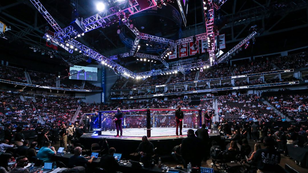 Fans await the next fight during a UFC 261 mixed martial arts event, Saturday, April 24, 2021, in Jacksonville, Fla.