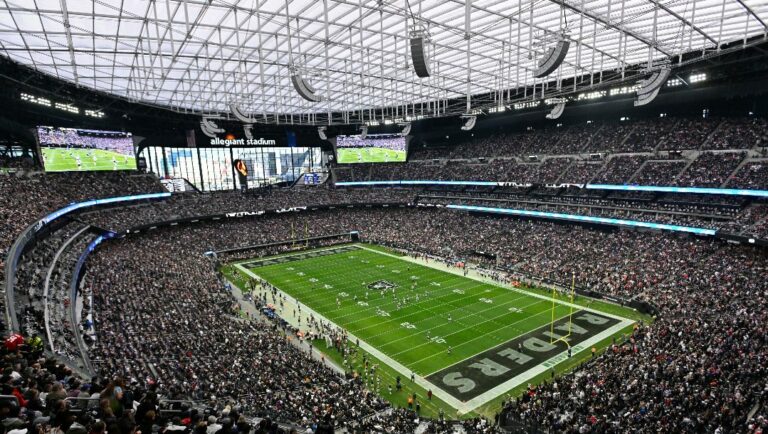 Spectators in Allegiant Stadium watch a play during the first half of an NFL football game between the New England Patriots and Las Vegas Raiders, Sunday, Dec. 18, 2022, in Las Vegas.