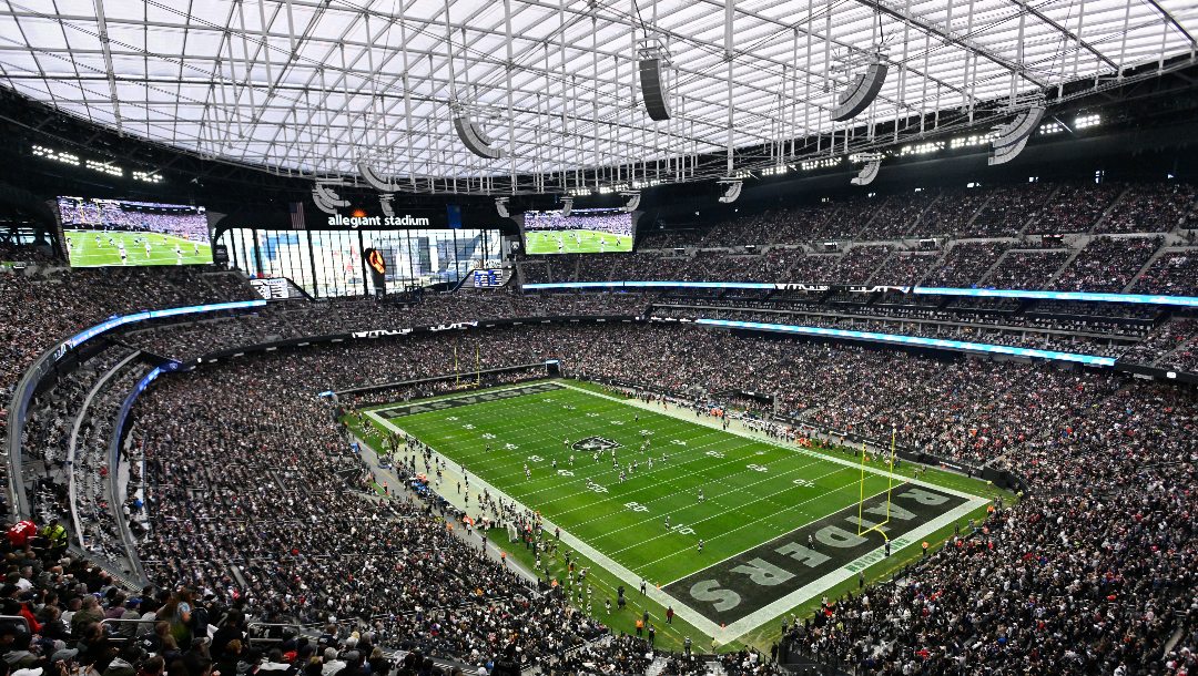 Spectators in Allegiant Stadium watch a play during the first half of an NFL football game between the New England Patriots and Las Vegas Raiders, Sunday, Dec. 18, 2022, in Las Vegas.