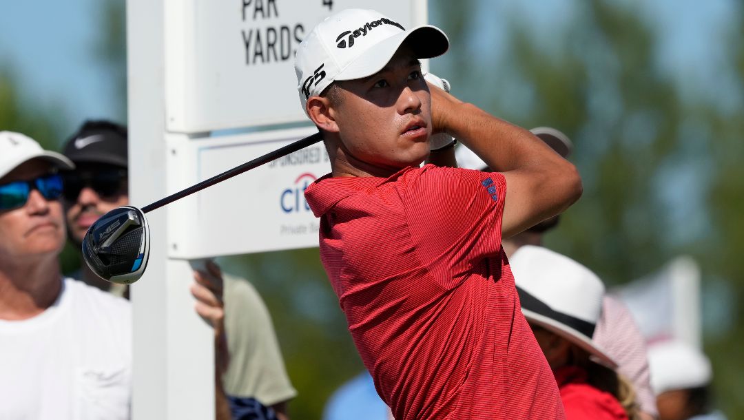 Collin Morikawa, of the United States, watches his shot from the first tee during the final round of the Hero World Challenge PGA Tour at the Albany Golf Club, in New Providence, Bahamas, Sunday, Dec. 3, 2023.