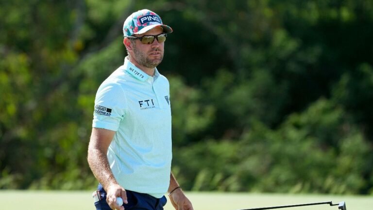 Corey Conners waves after his shot on the 18th green during the third round of The Sentry golf event, Saturday, Jan. 6, 2024, at Kapalua Plantation Course in Kapalua, Hawaii.