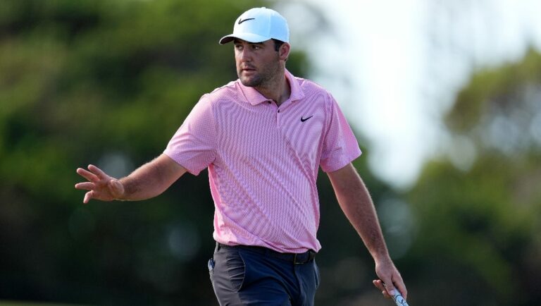 Scottie Scheffler acknowledges the gallery on the 10th green during the third round of The Sentry golf event, Saturday, Jan. 6, 2024, at Kapalua Plantation Course in Kapalua, Hawaii.