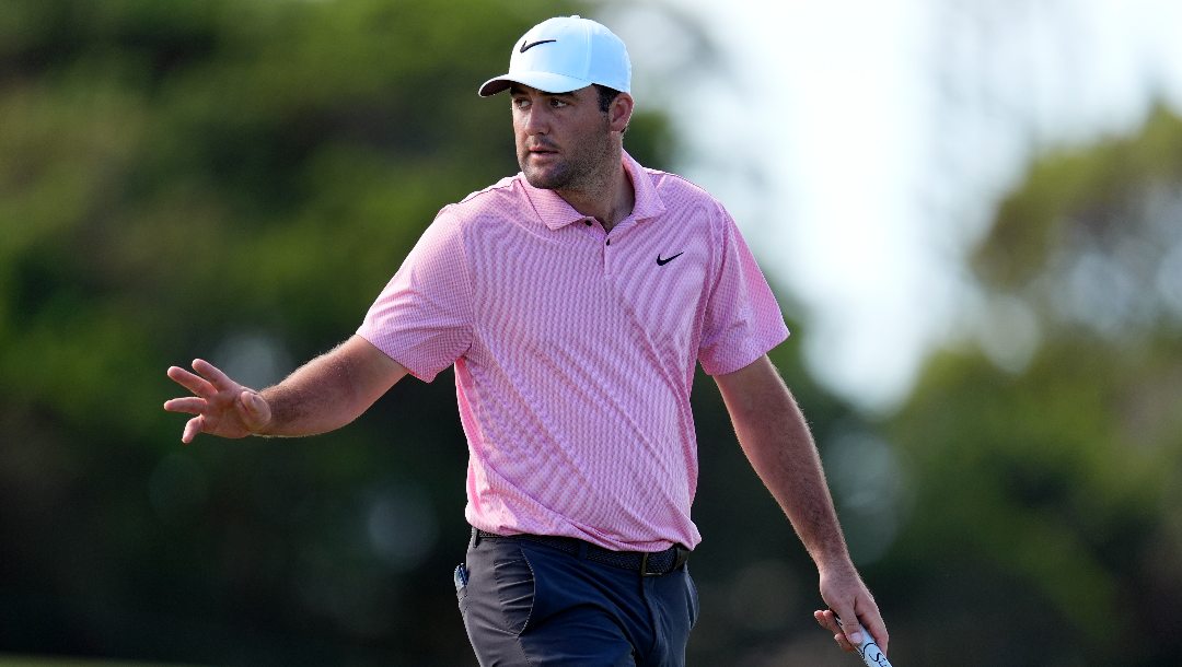 Scottie Scheffler acknowledges the gallery on the 10th green during the third round of The Sentry golf event, Saturday, Jan. 6, 2024, at Kapalua Plantation Course in Kapalua, Hawaii.
