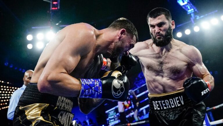 Artur Beterbiev, right, punches Joe Smith Jr. during the second round of a light heavyweight boxing bout Saturday, June 18, 2022.
