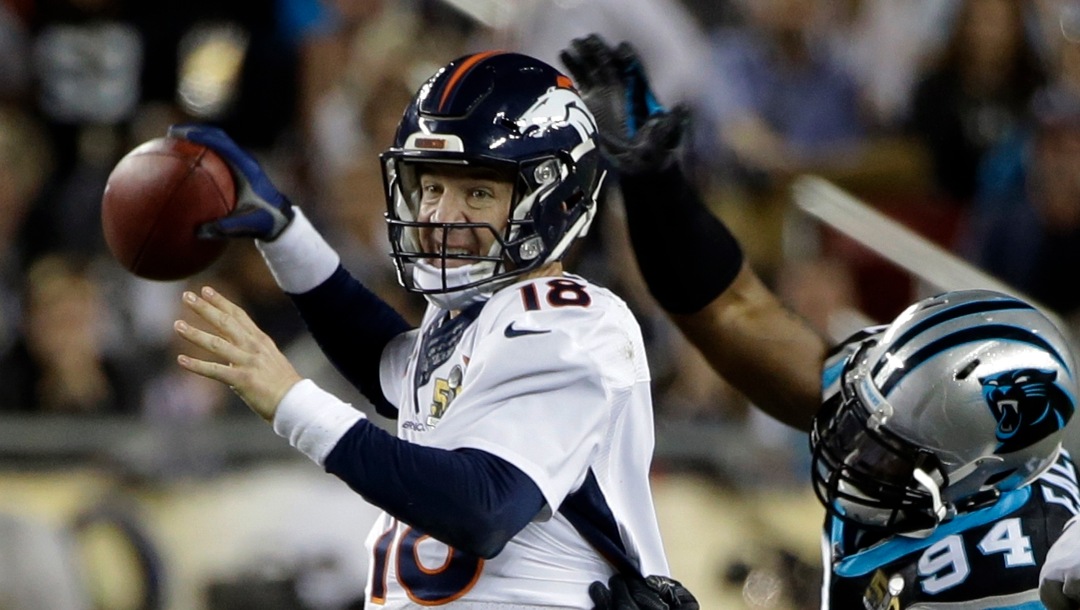 Denver Broncos’ Peyton Manning (18) loses the ball as he is hit by Carolina Panthers’ Kony Ealy (94) during the second half of the NFL Super Bowl 50 football game Sunday, Feb. 7, 2016, in Santa Clara, Calif. The Panthers recovered the fumble. (AP Photo/Marcio Jose Sanchez)