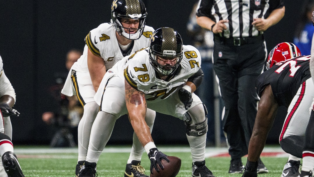 New Orleans Saints center Erik McCoy (78) prepares to snap to quarterback Derek Carr (4) during the first half of an NFL football game against the Atlanta Falcons, Sunday, Nov. 26, 2023, in Atlanta. The Atlanta Falcons won 24-15.