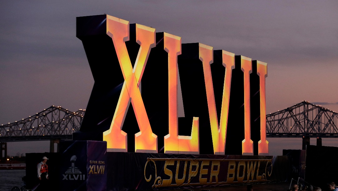 In this Feb. 2, 2013 file photo, the Roman numerals for NFL Super Bowl XLVII float on the Mississippi River in New Orleans.