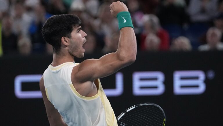 Carlos Alcaraz of Spain reacts during his quarterfinal match against Alexander Zverev of Germany at the Australian Open tennis championships at Melbourne Park, Melbourne, Australia, Wednesday, Jan. 24, 2024.