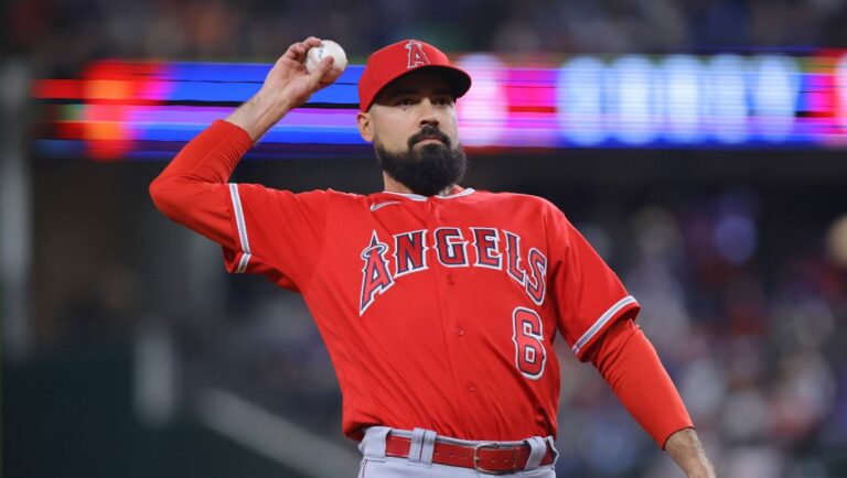 Los Angeles Angels third baseman Anthony Rendon throws the ball into the crowd in the first inning of a baseball game against the Texas Rangers, Tuesday, June 13, 2023, in Arlington, Texas.