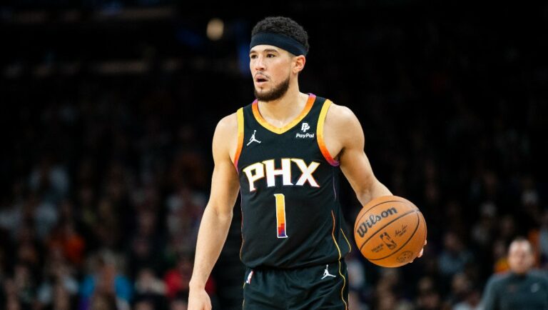 Devin Booker #1 of the Phoenix Suns controls the ball during the first half of the NBA game against the Milwaukee Bucks at Footprint Center on February 06, 2024 in Phoenix, Arizona.