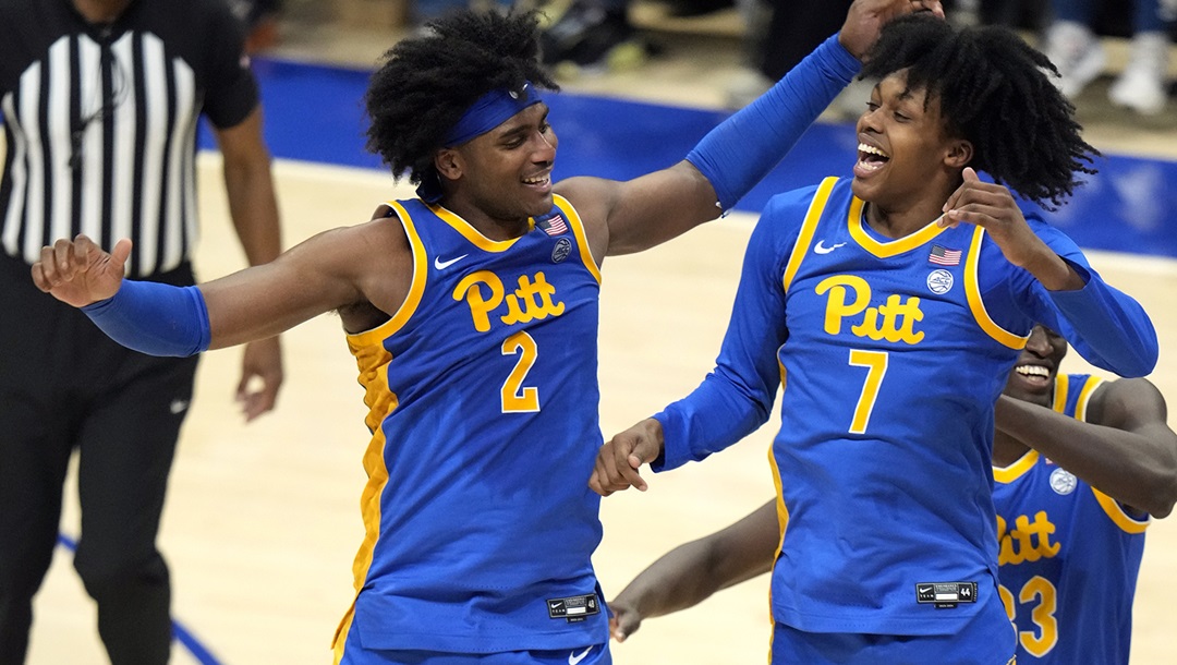 Pittsburgh 's Blake Hinson (2) celebrates with Carlton Carrington after scoring his 41st point during the second half of an NCAA college basketball game against Louisville in Pittsburgh Saturday, Feb. 17, 2024. Pitt won 86-59.
